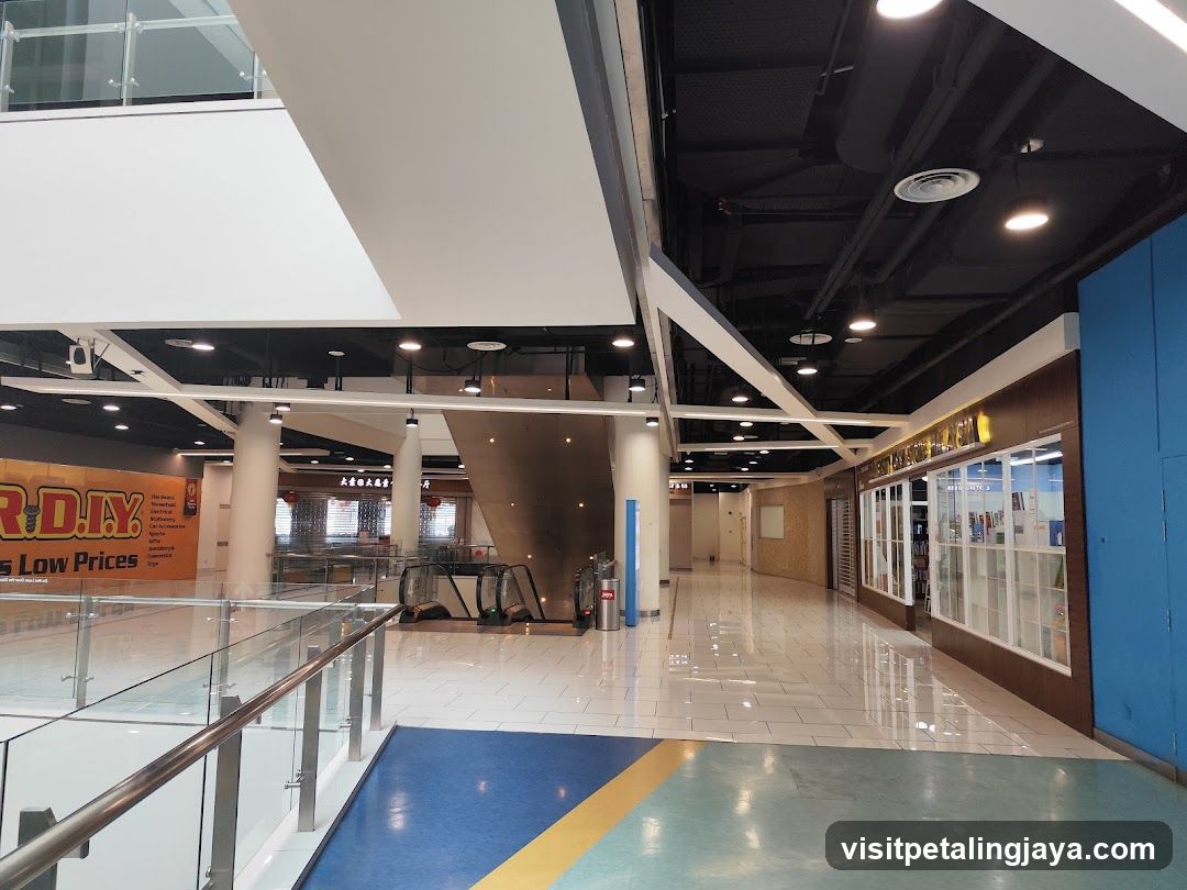 Shopping mall interior with escalators and shops