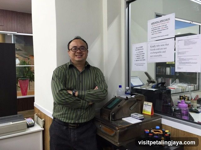 Man Posing by Counter