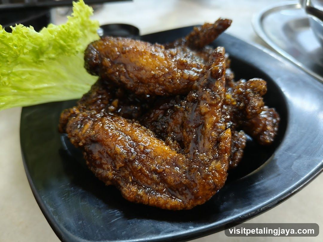 Sauced Chicken Wings with Lettuce Garnish