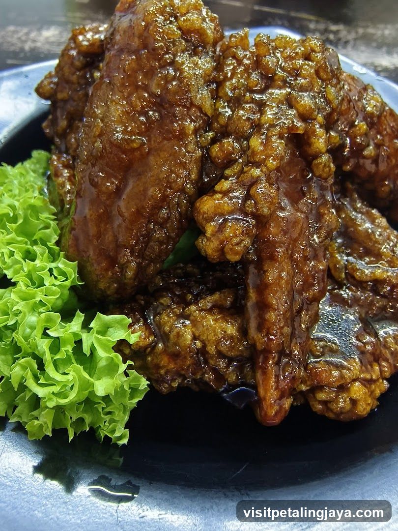 Sauced Fried Chicken with Lettuce Garnish
