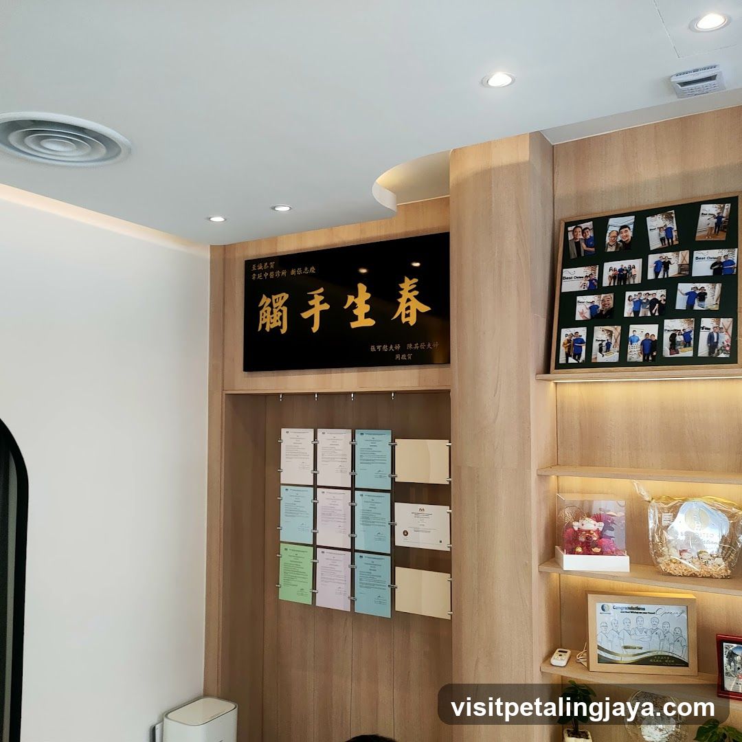 Interior of a business space with display wall and framed photos