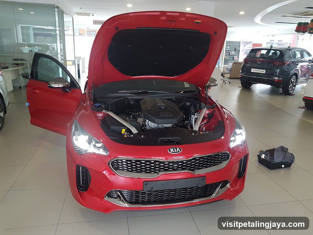 Red Kia Car in Showroom