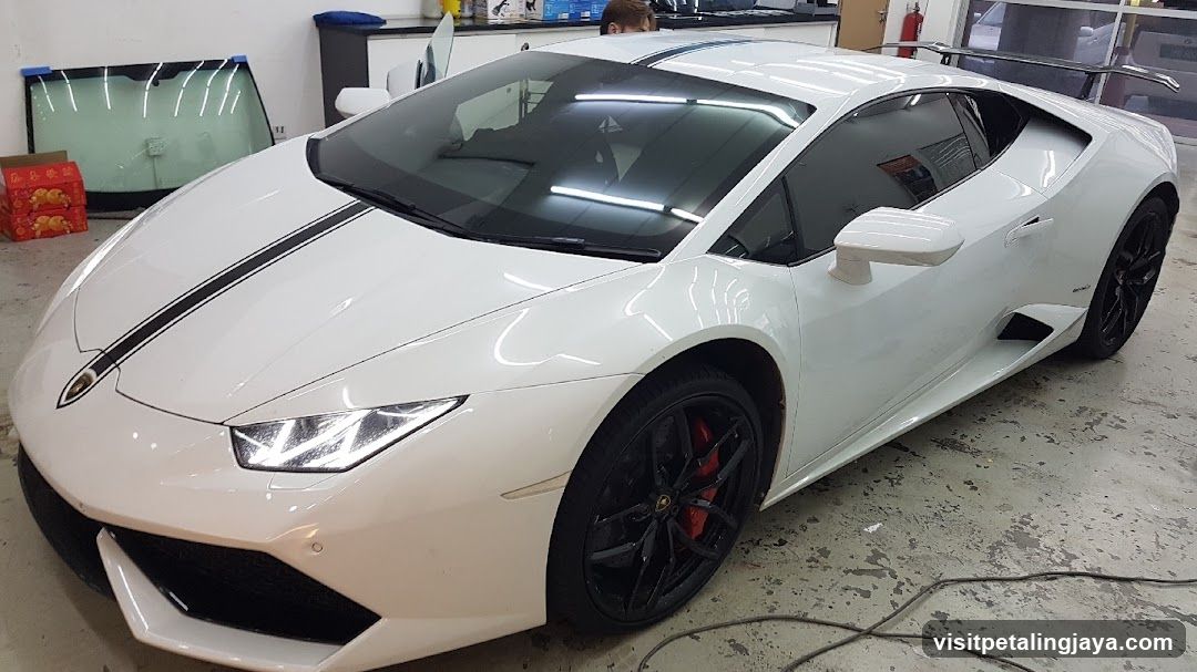 White Lamborghini Huracan in a workshop