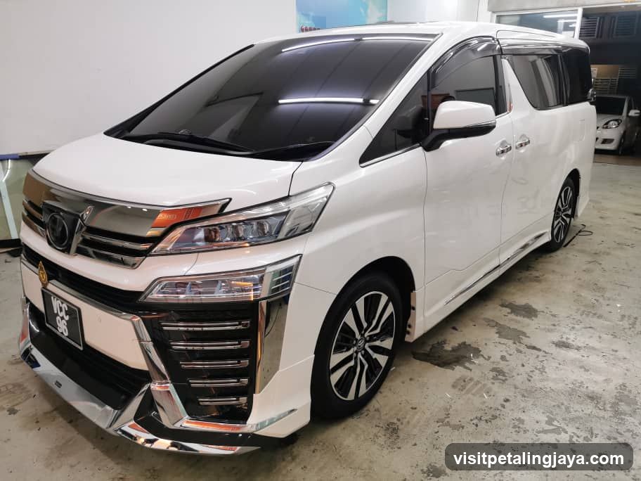White Toyota Alphard in a garage