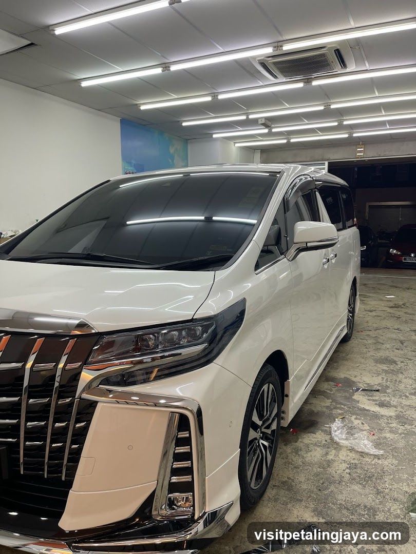 White Toyota Alphard in Workshop