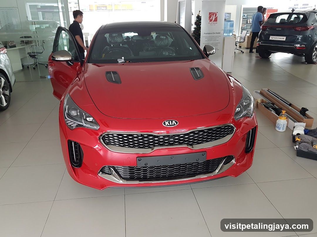Red Kia Car in Showroom