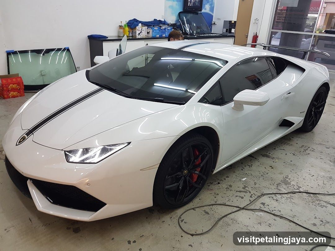 White Lamborghini Huracan in Workshop