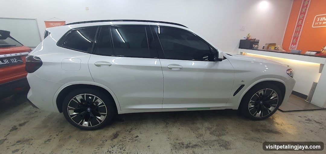 White SUV in Auto Shop Interior