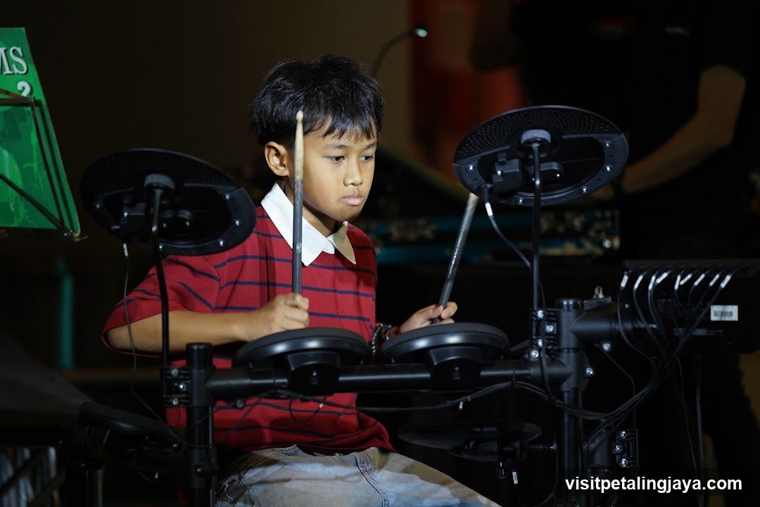 Boy Playing Electronic Drum Kit