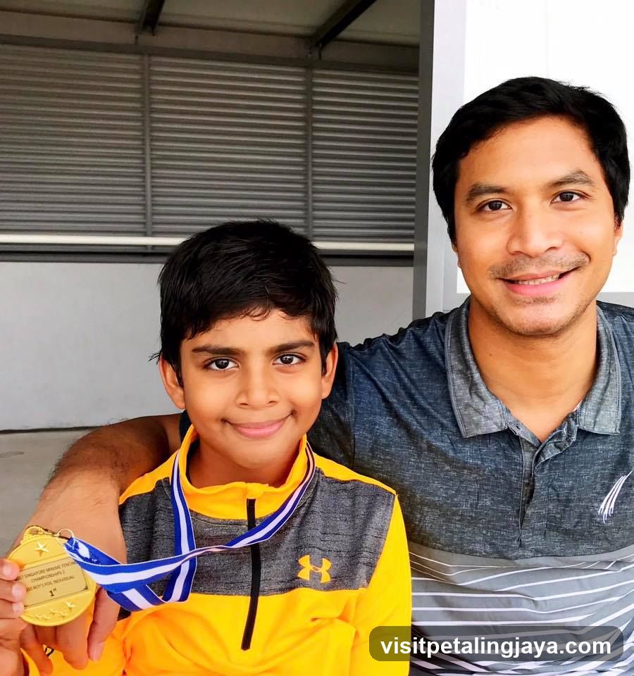 Boy with Gold Medal and Father