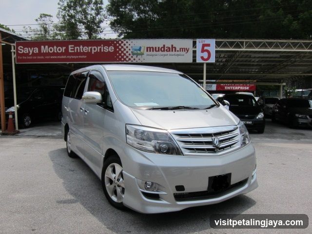 Silver Toyota Alphard in Car Dealership Lot