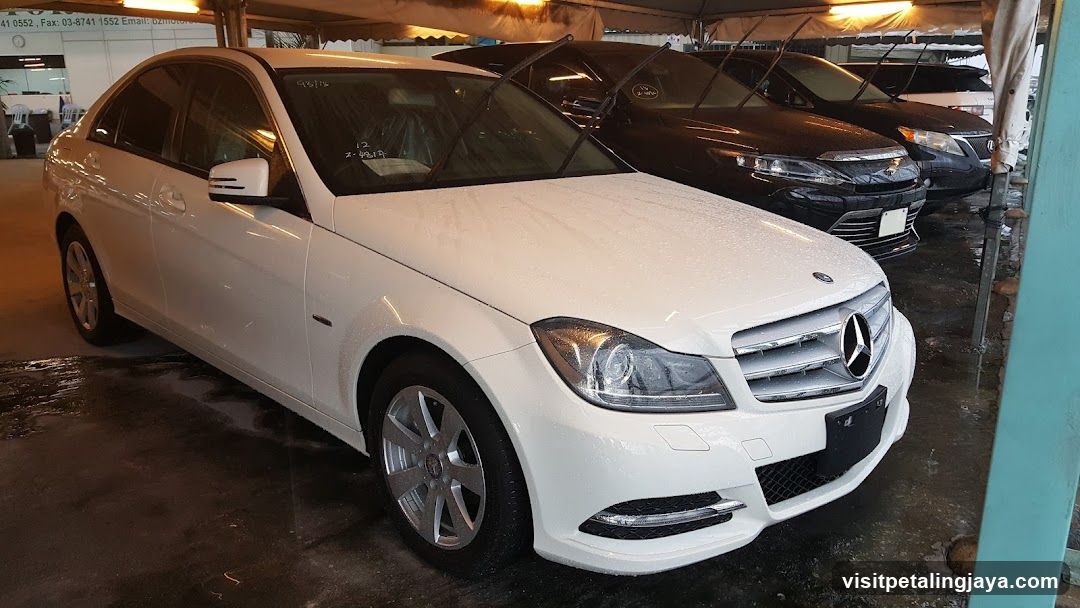 White Mercedes-Benz C-Class parked in a car lot