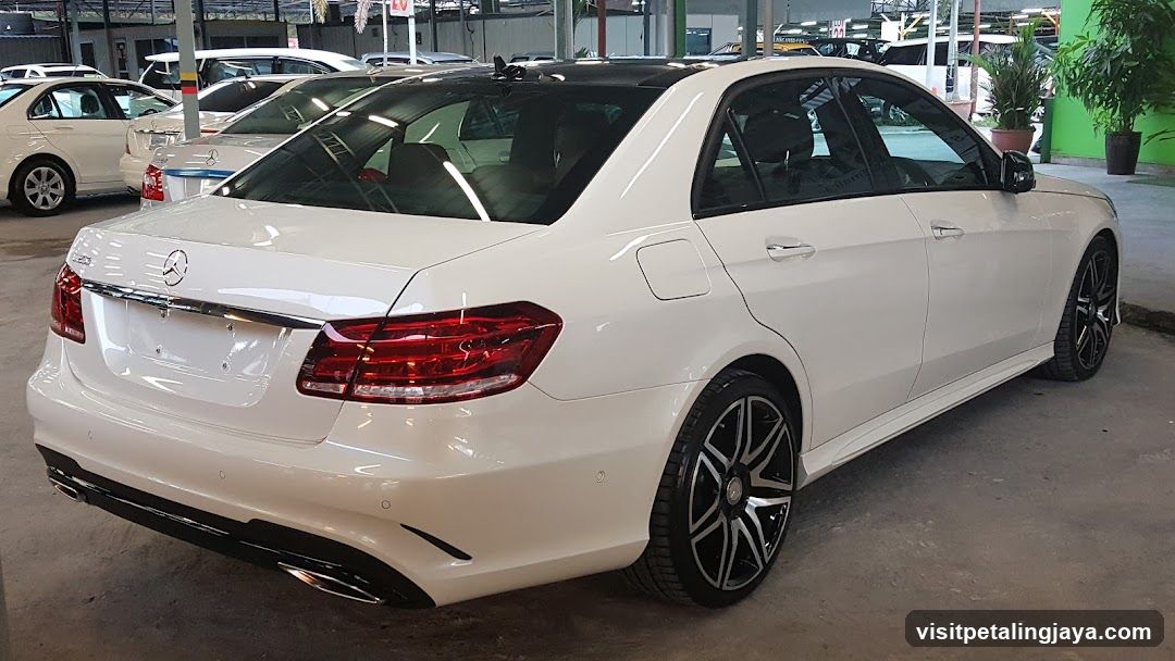 White Mercedes-Benz E-Class Sedan in Car Dealership Lot