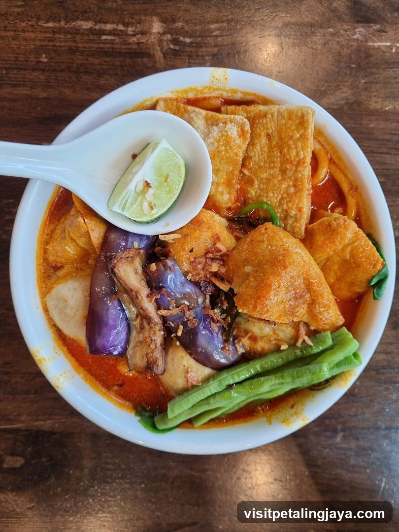 Spicy Noodle Dish with Lime Wedge