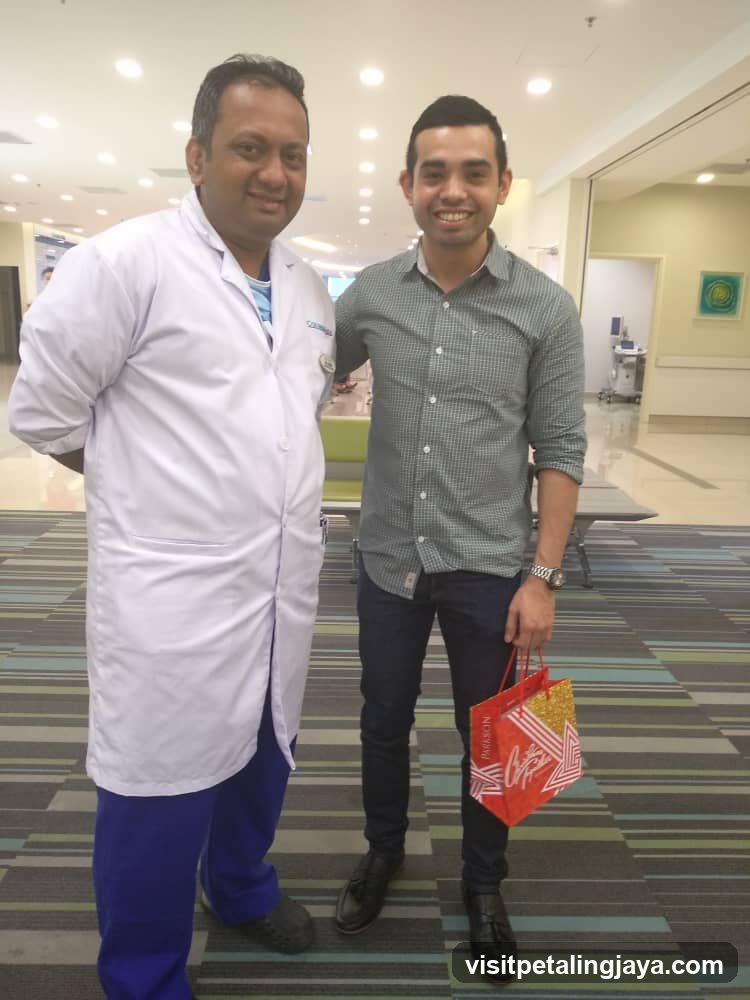 Doctor and Patient in Hospital Corridor