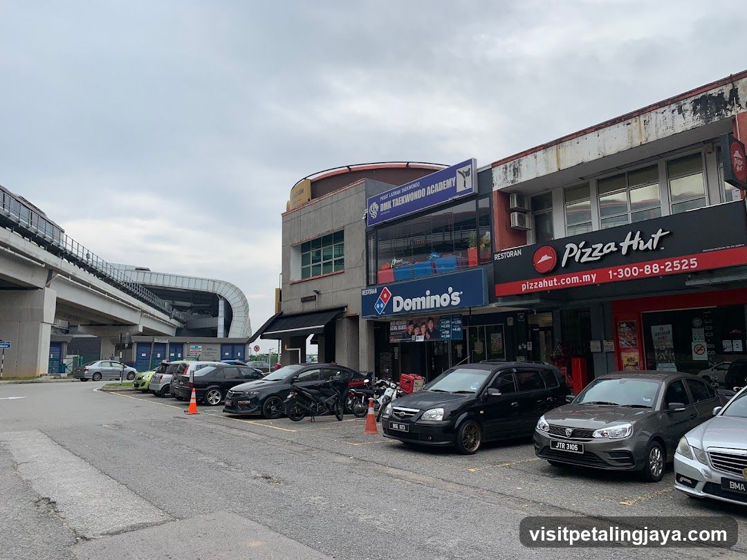 Street View with Shops and Vehicles