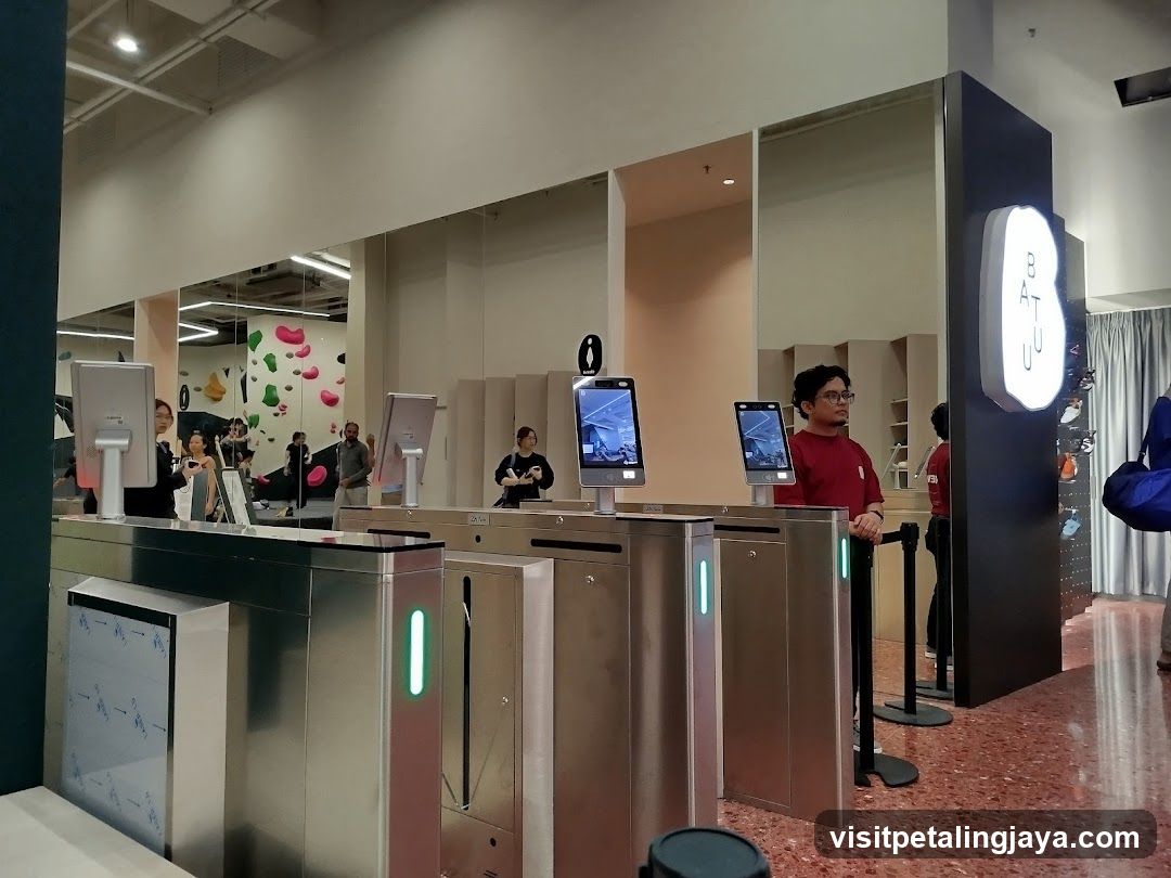 Turnstile Entrance with Staff and Customers