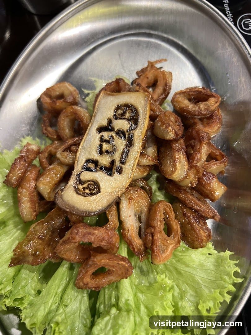 Fried Pork Rinds with Charred Sausage Slice