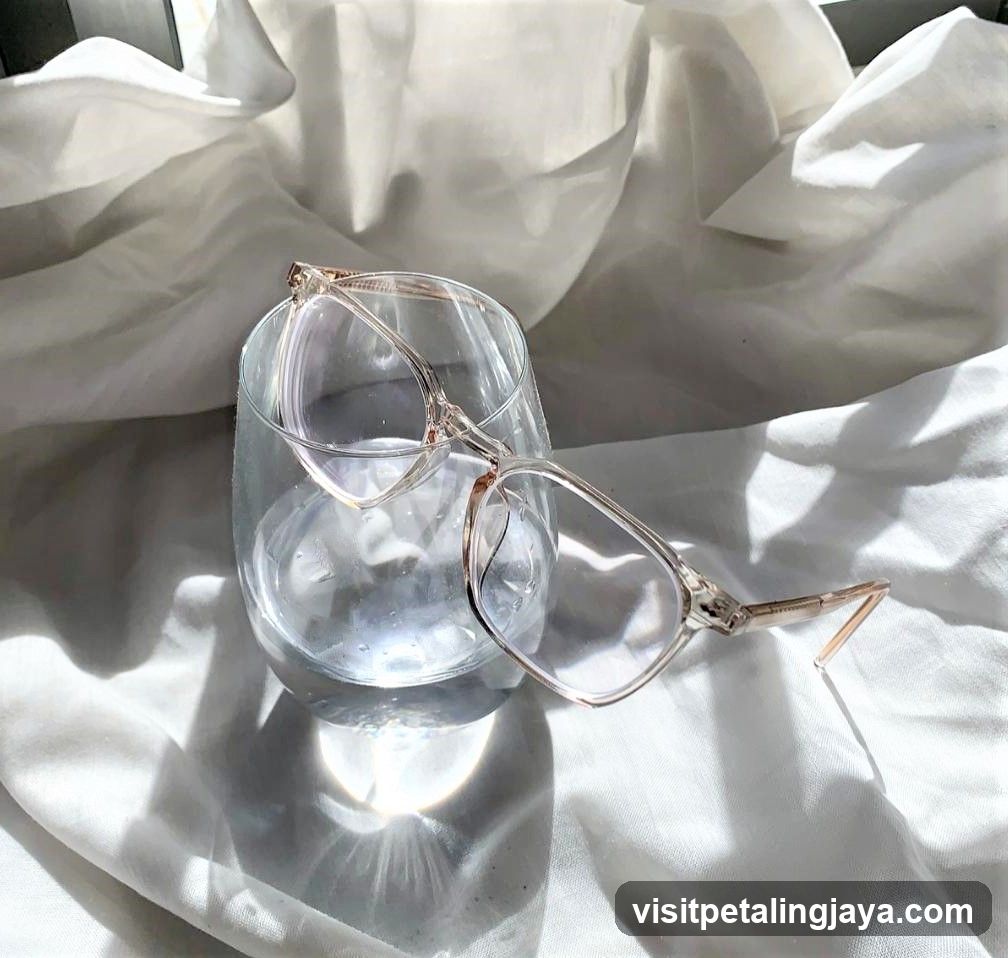 Glasses in Glass with White Fabric Background