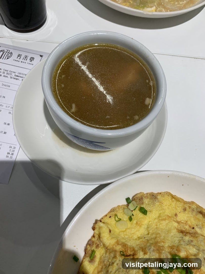 Dish with soup and omelette