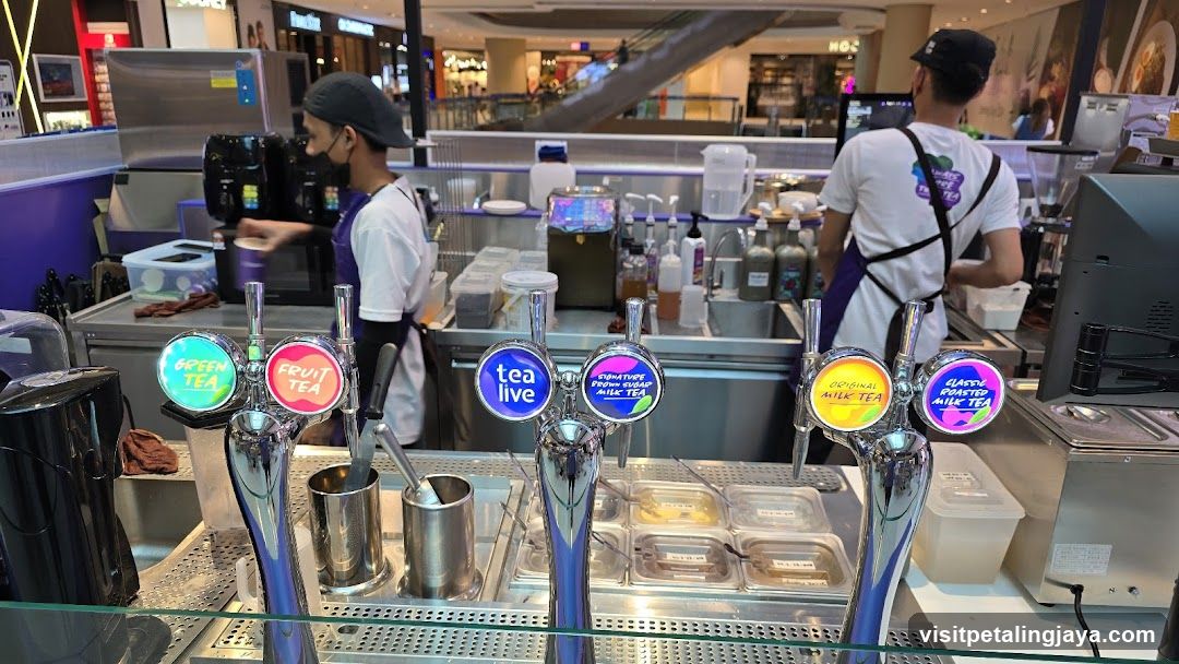 Tea Shop Interior with Staff and Drink Dispensers