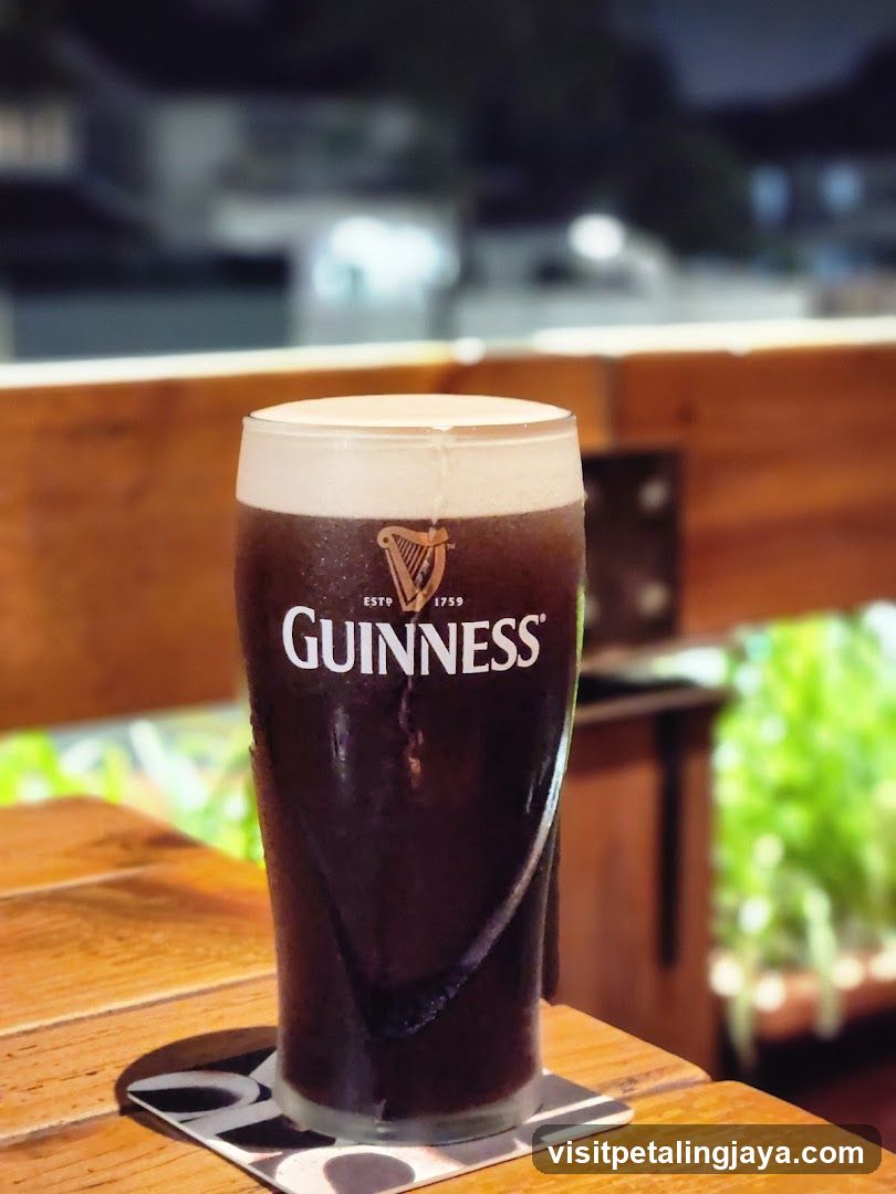 Guinness Pint on Wooden Table