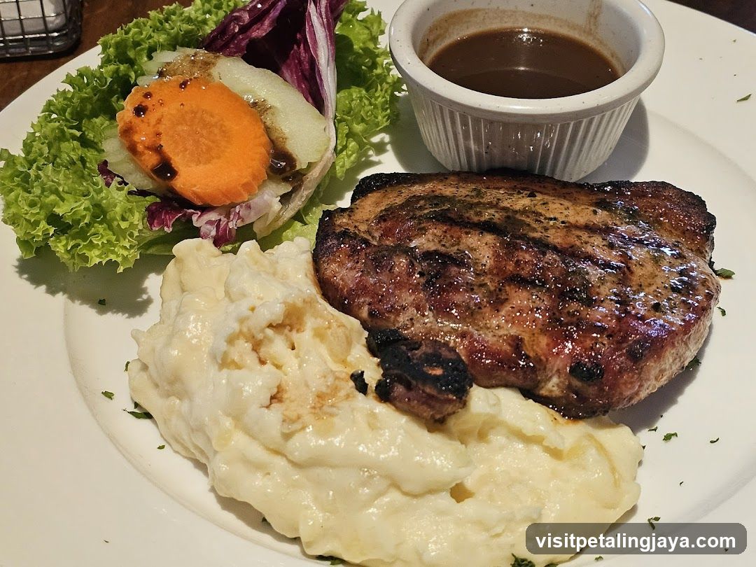 Grilled Pork Chop with Mashed Potatoes and Salad