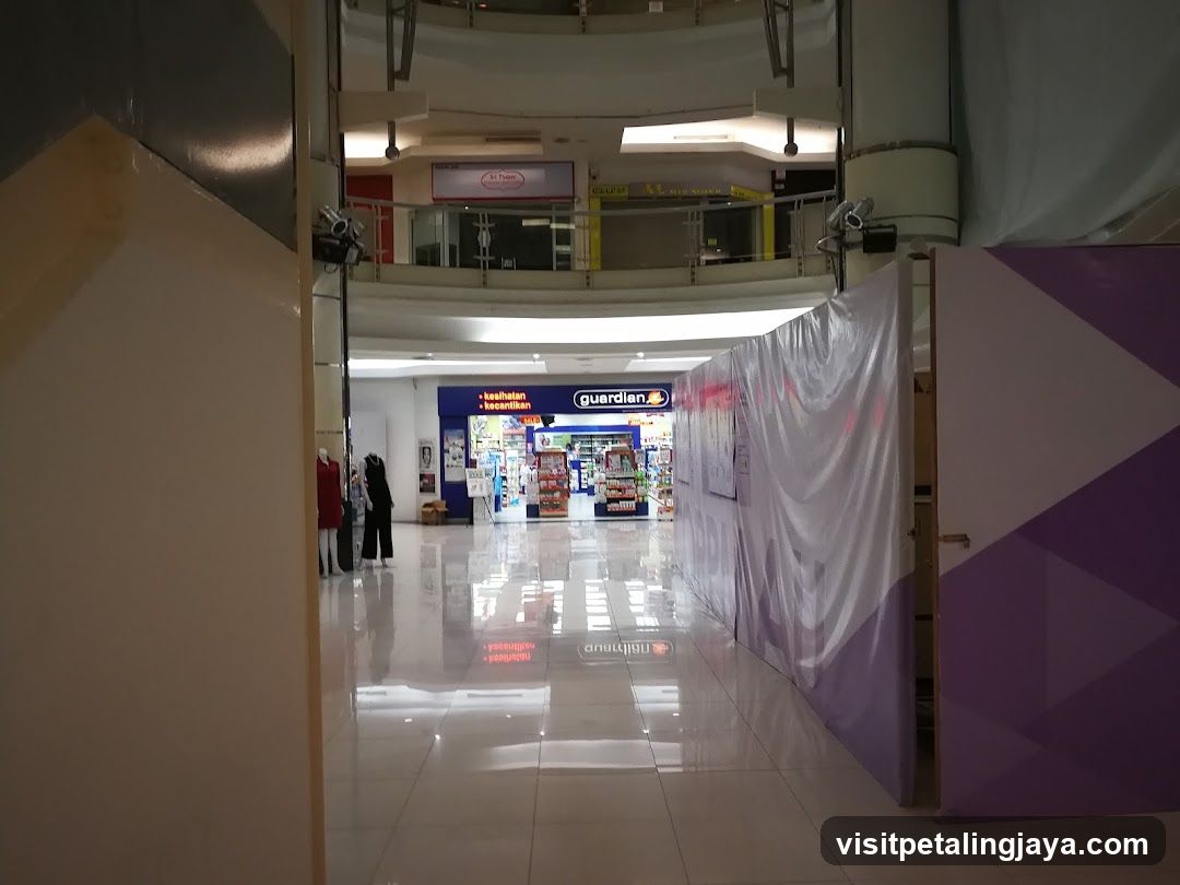 Shopping Mall Interior with Storefront and Construction Barrier