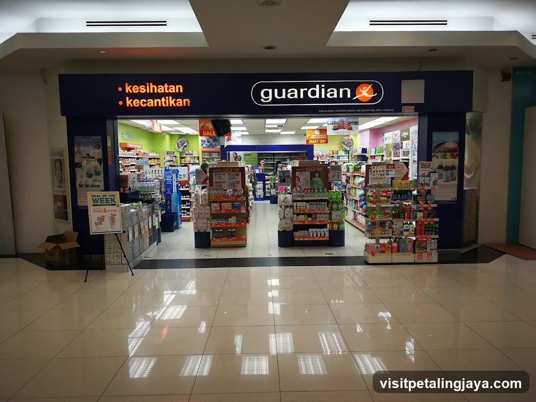 Photo of the physical exterior entrance of a Guardian pharmacy, showing signage with 'kesihatan' and 'kecantikan' categories visible above the store.