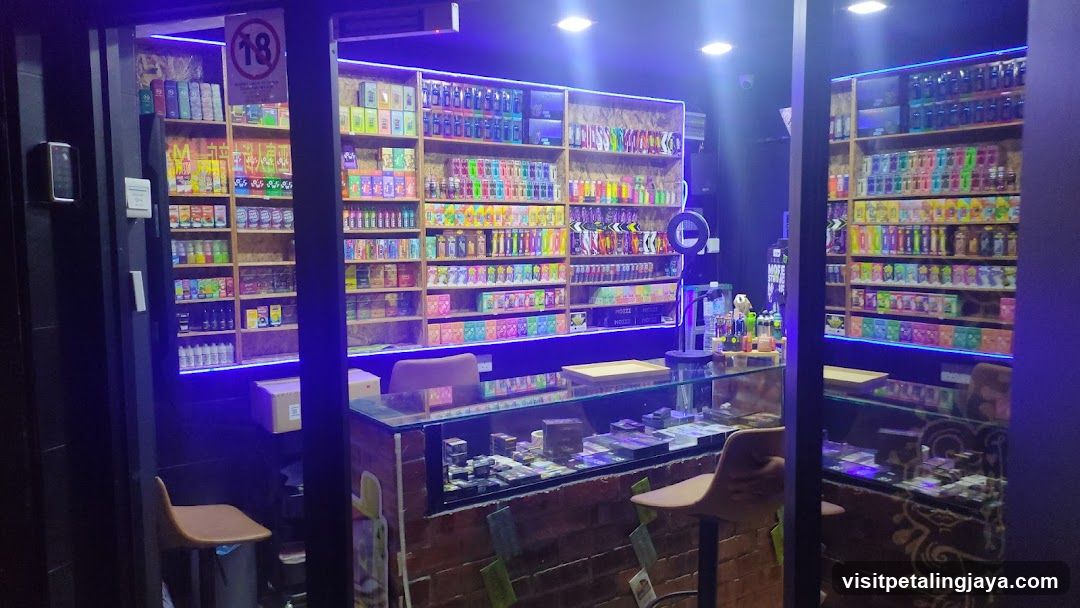Interior of a brightly lit convenience store with neon lighting and glass display counters.