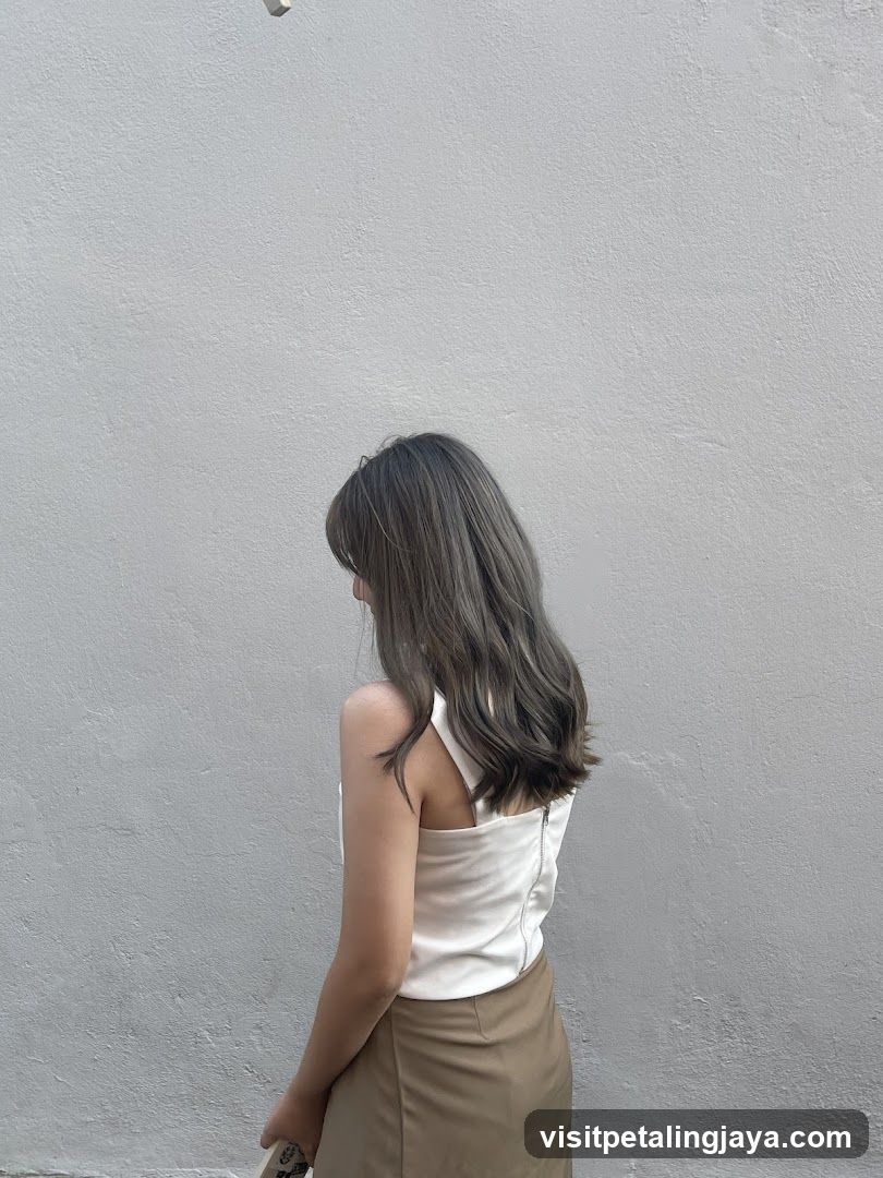 Woman with Grey Hair Standing Against a Wall