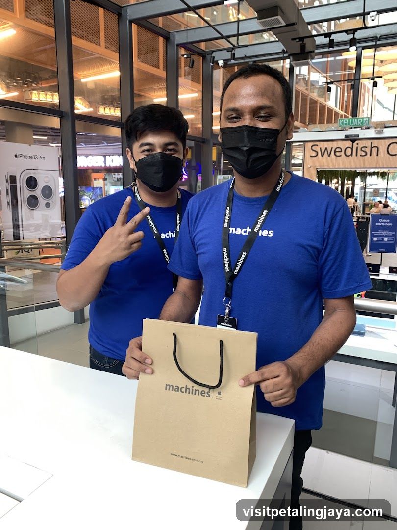 Staff with shopping bag in store