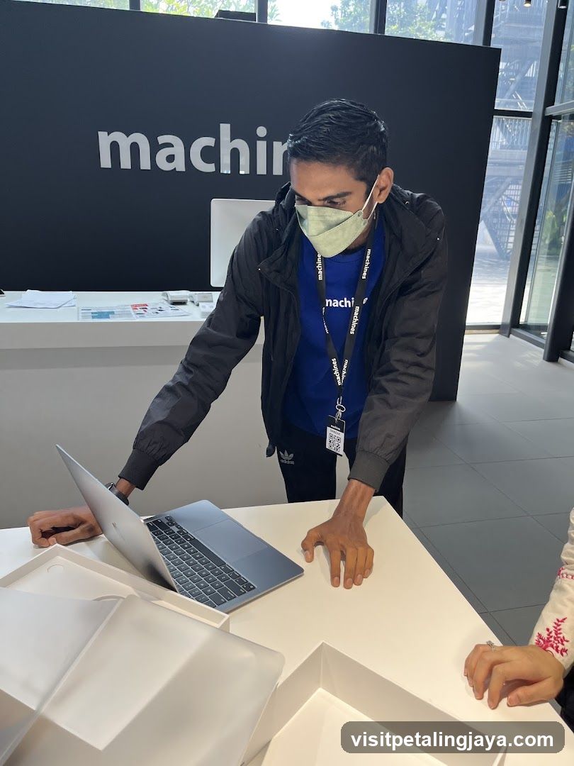 Staff with laptop at counter