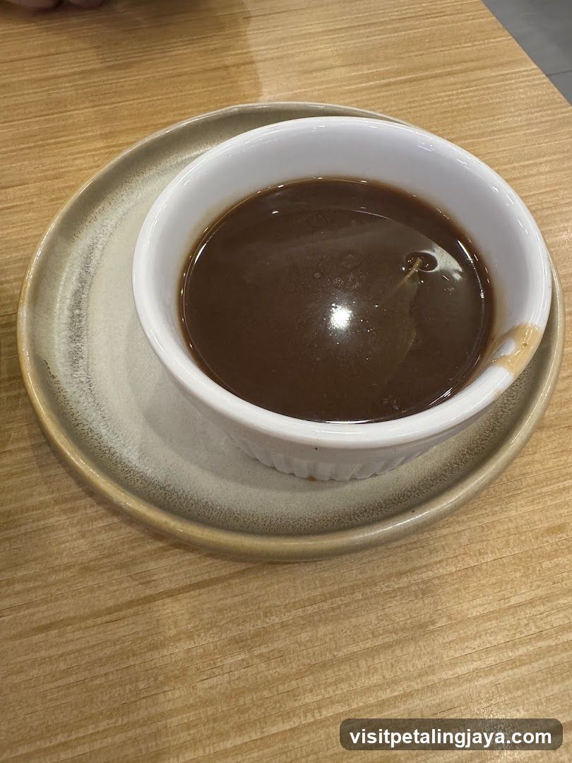 Bowl of Dark Soup or Broth
