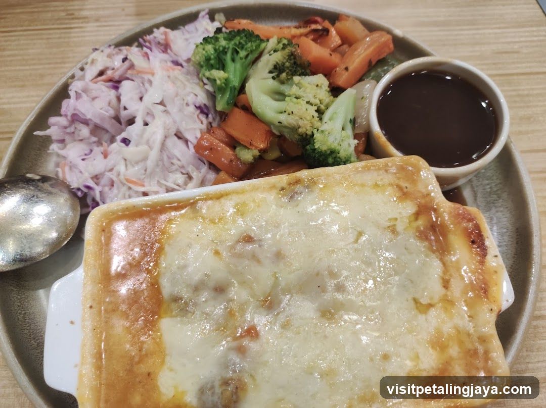 Baked Dish with Side Salad and Sauce