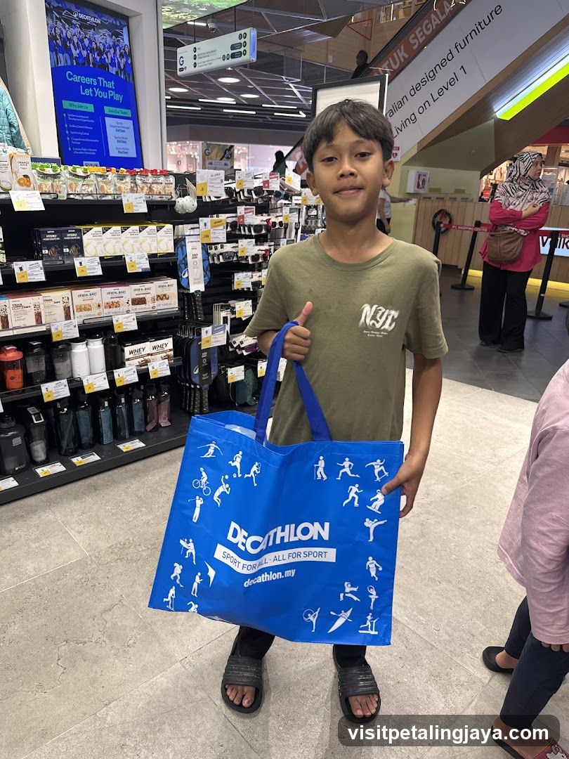 Boy holding Decathlon bag in store