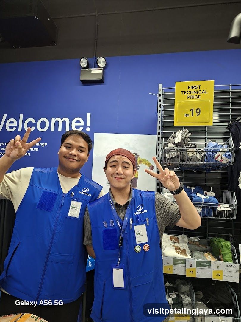 Staff in blue vests posing inside store