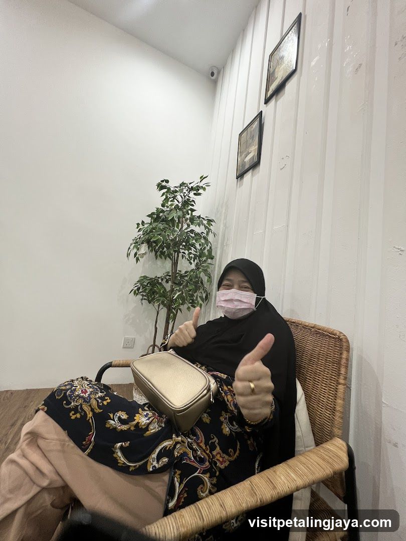 Woman Giving Thumbs Up in Interior Setting