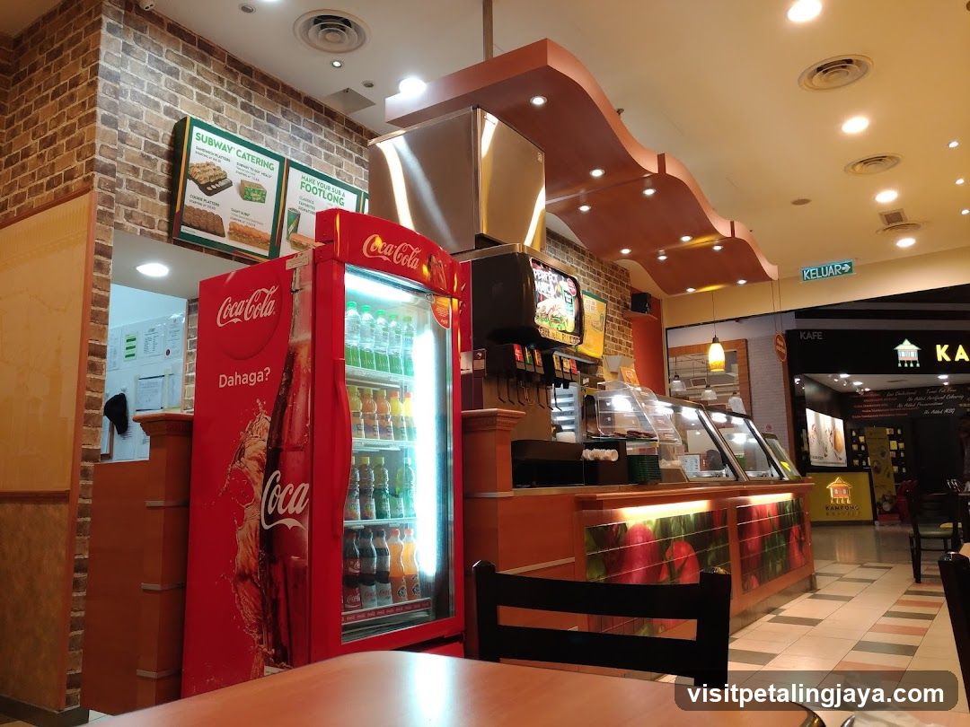Cafe Interior with Coca-Cola Fridge and Menu Boards