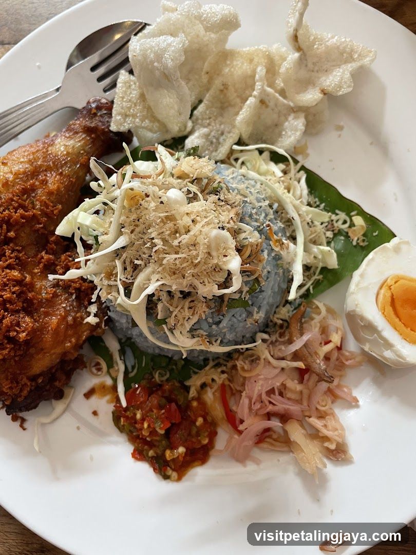 Plate of Fried Chicken with Rice and Side Dishes