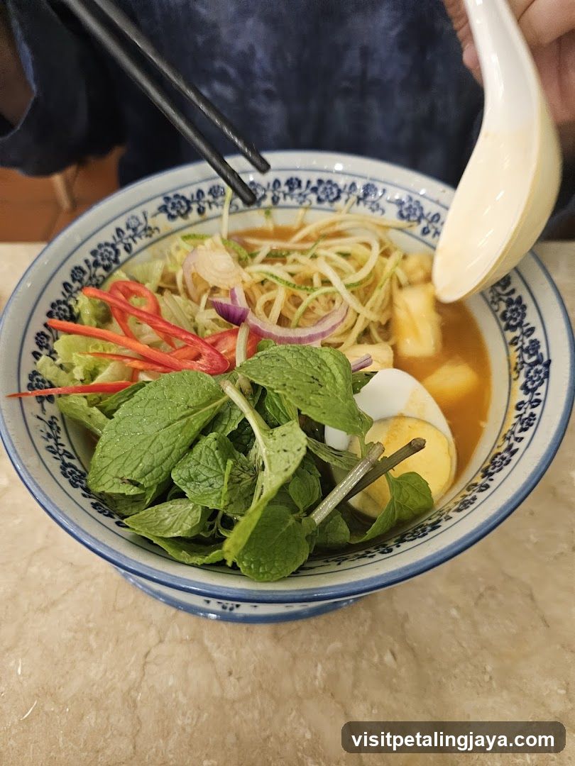 Bowl of Noodle Soup with Fresh Herbs