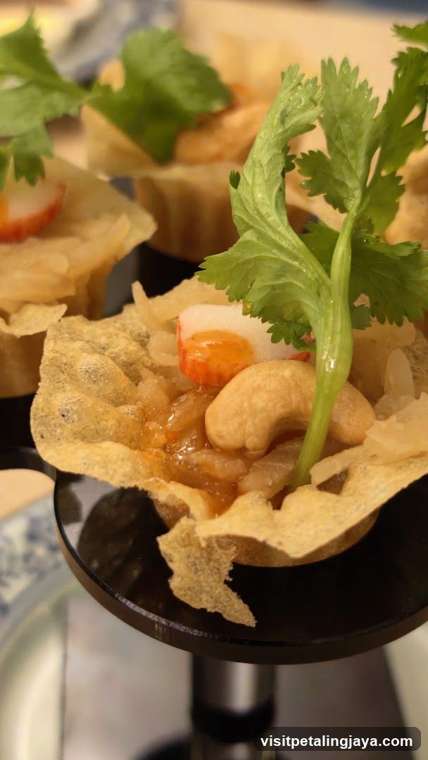 Crispy Shell Appetizer with Cashew and Herb Garnish