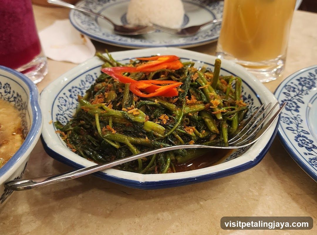 Dish of stir-fried greens with chili peppers