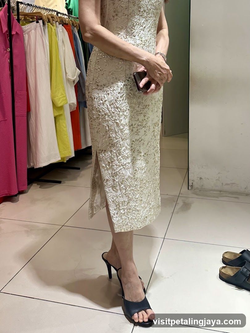 Woman in Lace Dress at Clothing Store