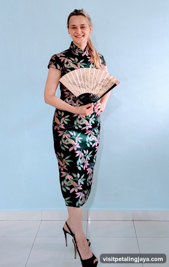 Woman in Floral Cheongsam with Fan