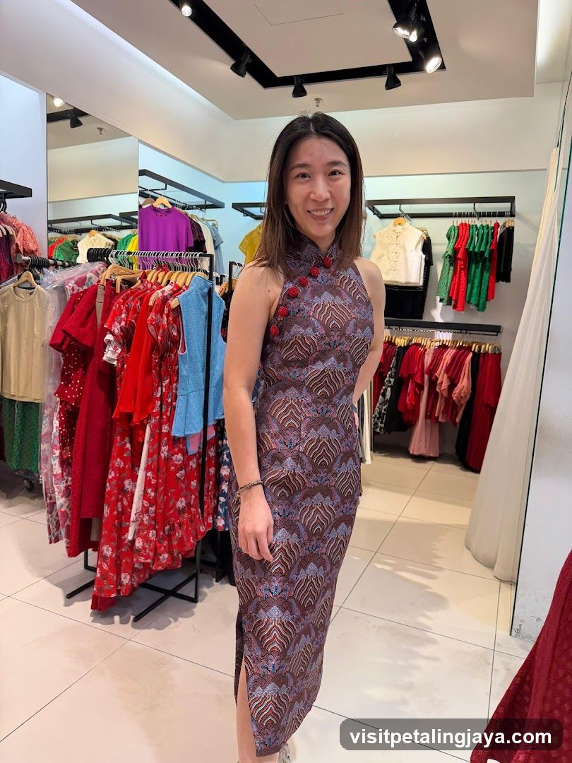 Woman in patterned dress inside clothing store