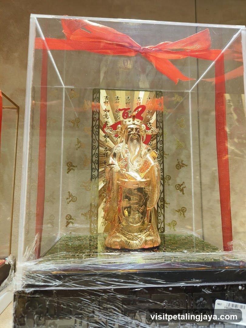 Golden Statue in Display Case