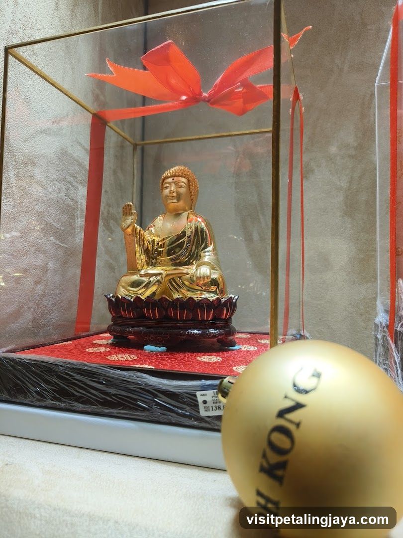 Golden Buddha Statue in Display Case