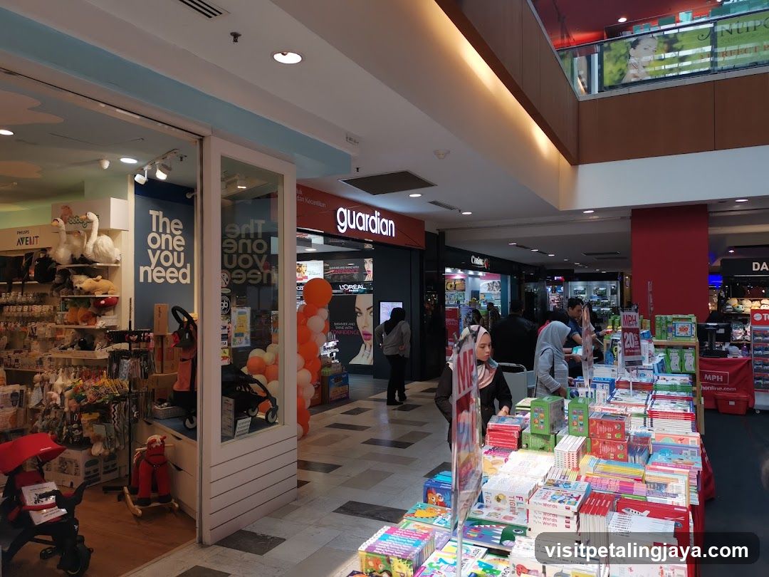 Shopping Mall Interior with Storefronts and Book Display