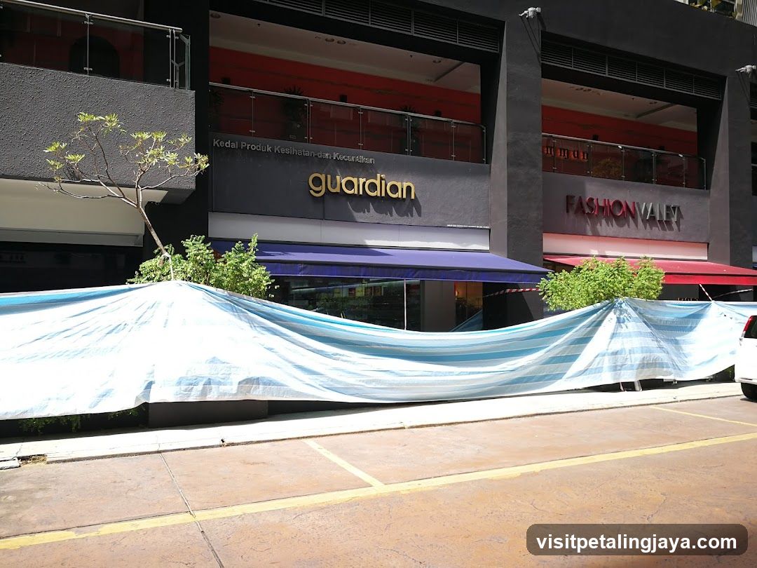 Guardian Storefront with Blue Tarp Covering